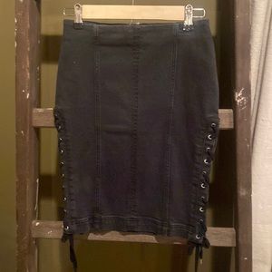 Cute Free People black skirt with lacing down both sides. Size 2 and never worn